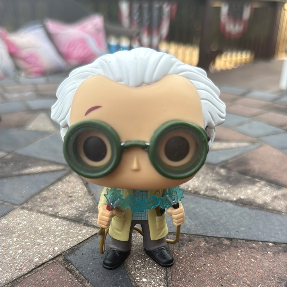 Funko Action Figure with White Hair and Green Glasses